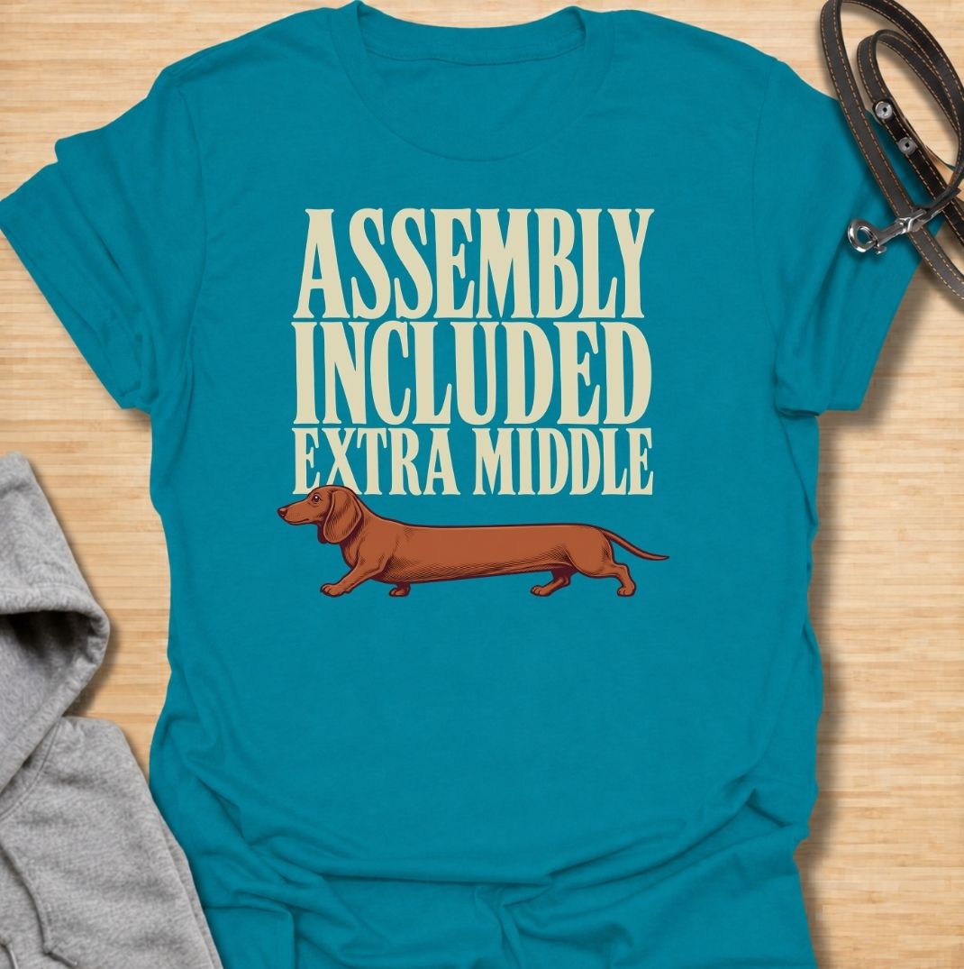 A funny dachshund T-shirt for anyone who knows these little dogs seem to have been built with a little too much middle. Featuring the phrase “Assembly Included Extra Middle” with a long dachshund illustration, this design turns the breed’s unmistakable shape into a dry, clever joke. Perfect for dachshund moms, dachshund dads, sausage dog owners, and anyone who loves breed-specific humor. A playful everyday tee for fans of dachshunds, wiener dogs, and funny dog gifts with a vintage feel.