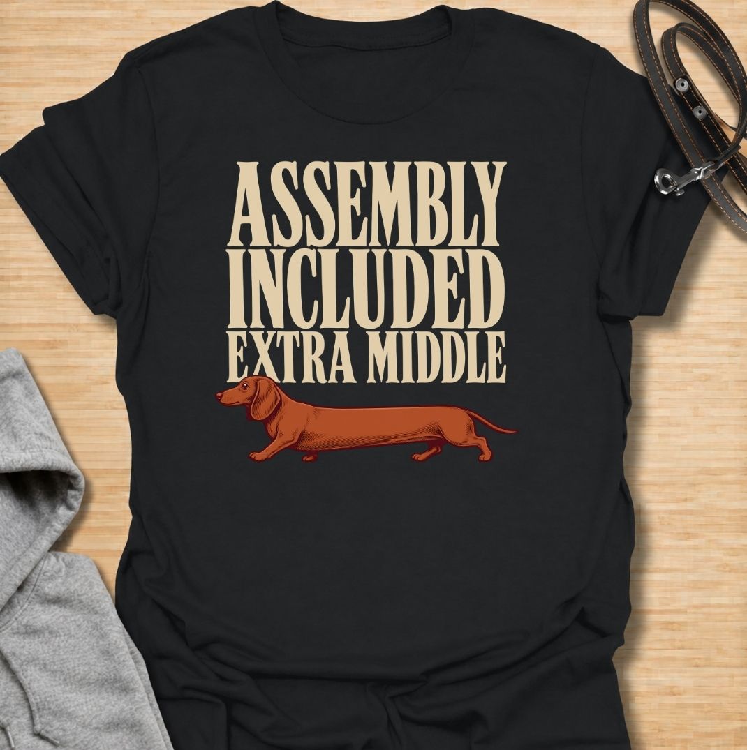 A funny dachshund T-shirt for anyone who knows these little dogs seem to have been built with a little too much middle. Featuring the phrase “Assembly Included Extra Middle” with a long dachshund illustration, this design turns the breed’s unmistakable shape into a dry, clever joke. Perfect for dachshund moms, dachshund dads, sausage dog owners, and anyone who loves breed-specific humor. A playful everyday tee for fans of dachshunds, wiener dogs, and funny dog gifts with a vintage feel.