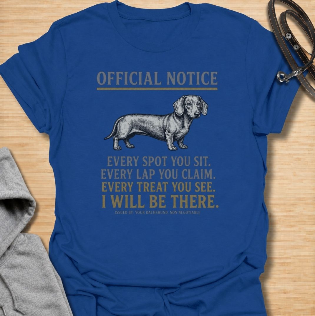 A funny dachshund T-shirt for anyone who knows personal space stops existing once a dachshund moves in. Featuring the phrase “Every Spot You Sit. Every Lap You Claim. Every Treat You See. I Will Be There,” this design captures the breed’s clingy, food-focused personality with dry humor. Perfect for dachshund moms, dachshund dads, sausage dog owners, and anyone living with a devoted little shadow. A playful everyday tee for fans of dachshund humor, velcro dogs, and breed-specific dog gifts.
