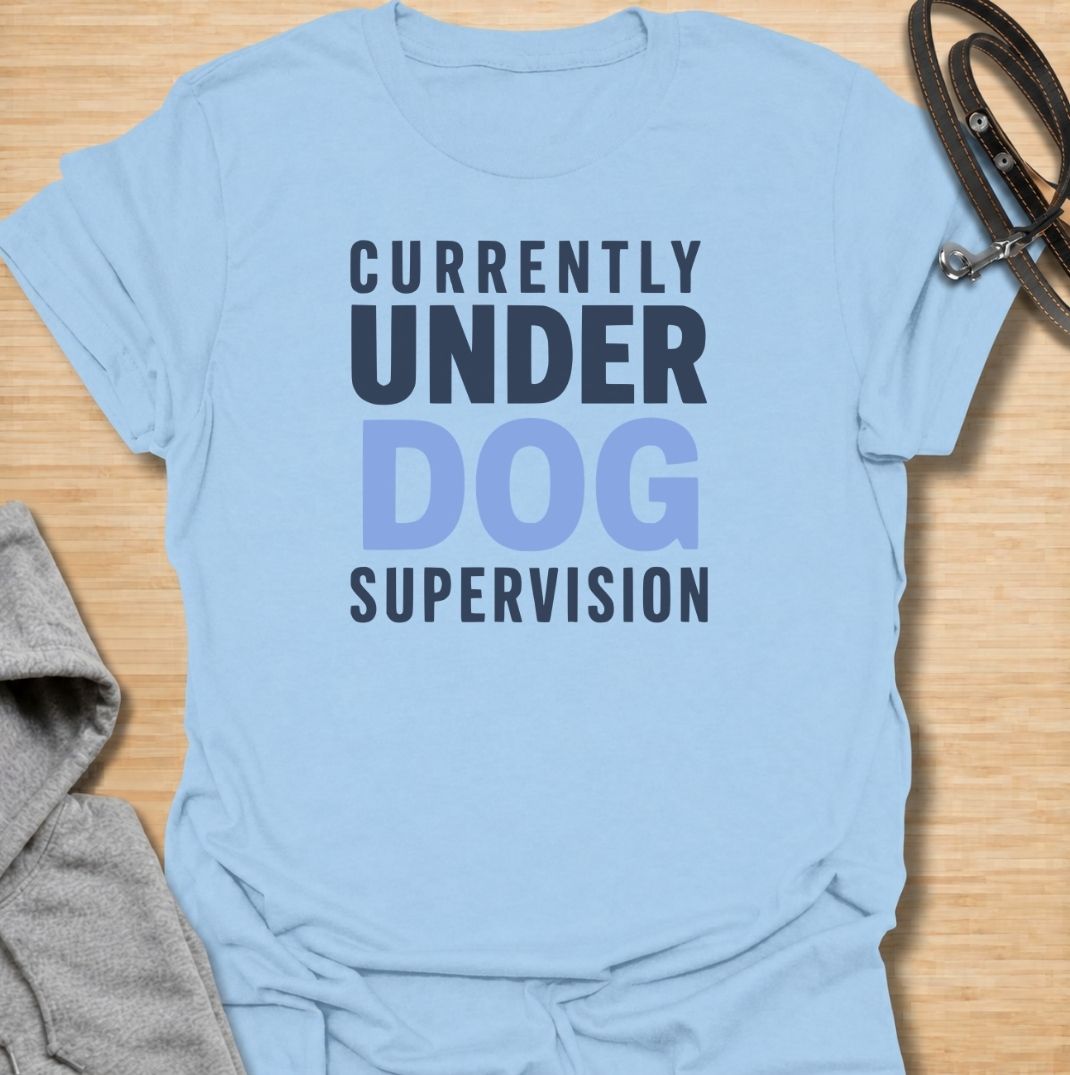 A funny dog T-shirt for anyone who knows their four-legged supervisor is always watching. Featuring the phrase “Currently Under Dog Supervision,” this clean text-based design is perfect for dog owners whose pets like to keep a close eye on everything they do. Ideal for dog moms, dog dads, rescue dog owners, and anyone who lives life under constant canine observation. A simple everyday tee for fans of funny dog sayings, dog lover humor, and general dog gifts.