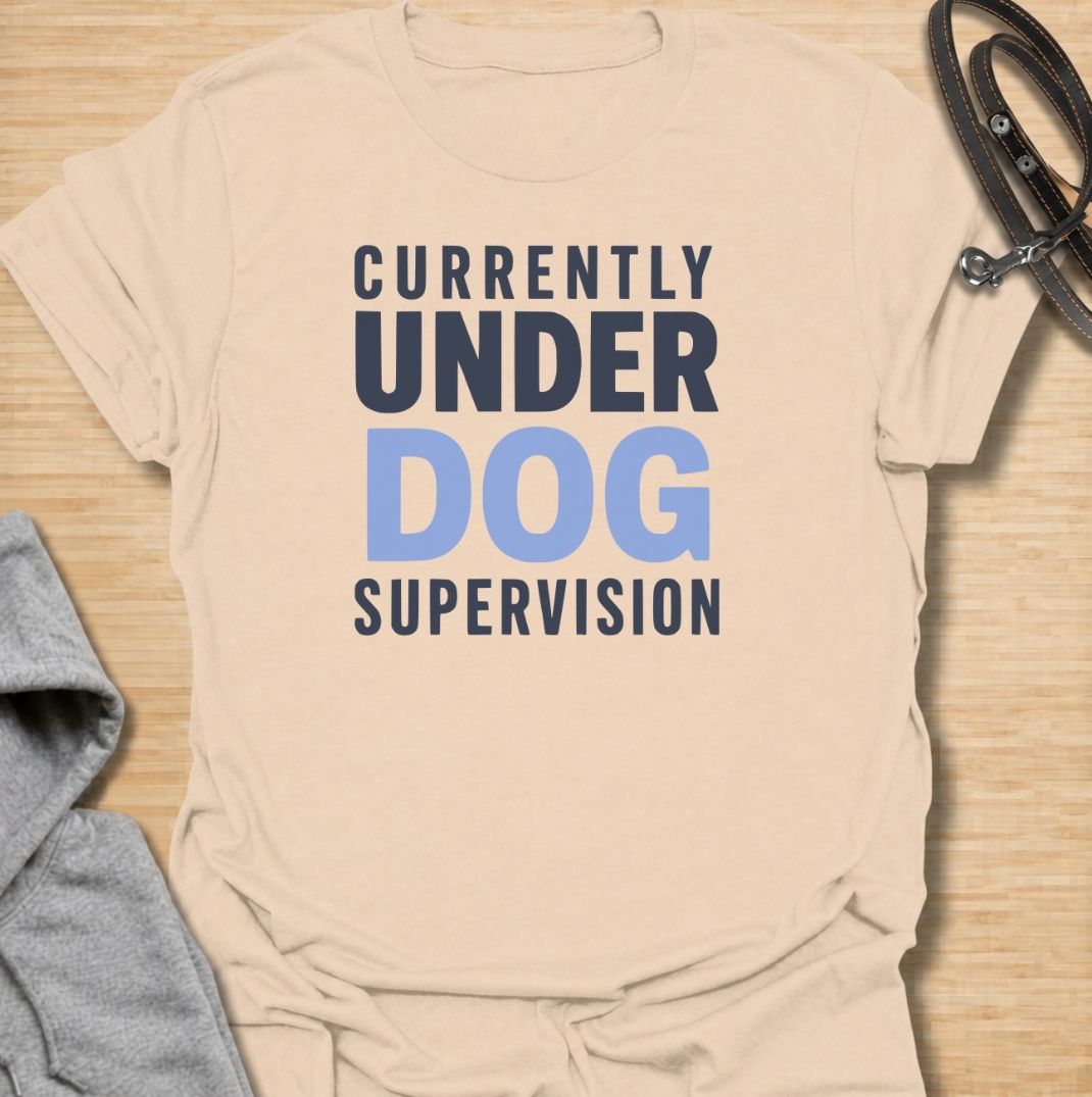 A funny dog T-shirt for anyone who knows their four-legged supervisor is always watching. Featuring the phrase “Currently Under Dog Supervision,” this clean text-based design is perfect for dog owners whose pets like to keep a close eye on everything they do. Ideal for dog moms, dog dads, rescue dog owners, and anyone who lives life under constant canine observation. A simple everyday tee for fans of funny dog sayings, dog lover humor, and general dog gifts.