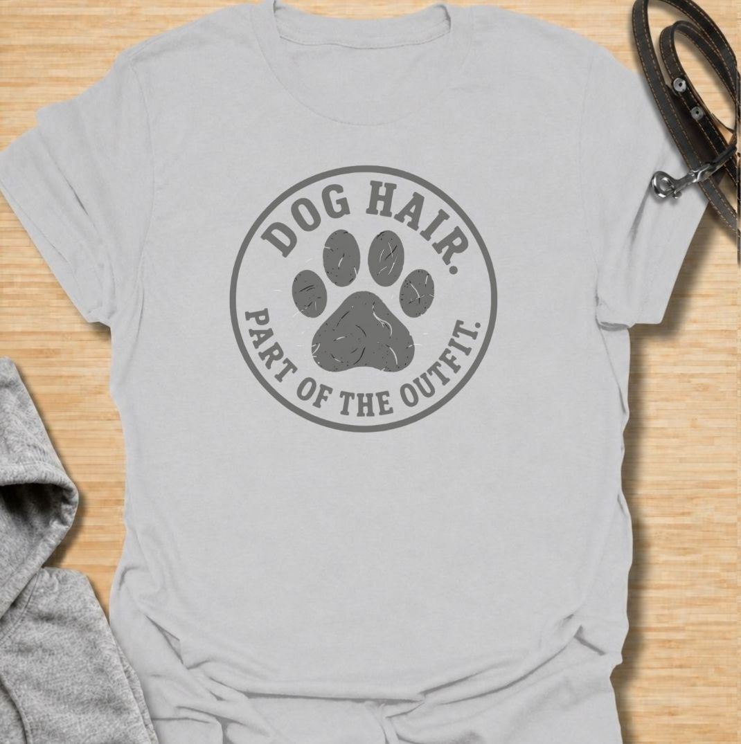 A funny dog T-shirt for anyone who has accepted that pet hair is simply part of everyday life. Featuring the phrase “Dog Hair. Part of the Outfit.” with a paw print graphic, this design is a relatable choice for dog owners who are permanently covered in a little extra fur. Perfect for dog moms, dog dads, rescue dog owners, and anyone who wears their dog’s hair with pride. A simple everyday tee for fans of dog humor, pet lover gifts, and general dog designs.