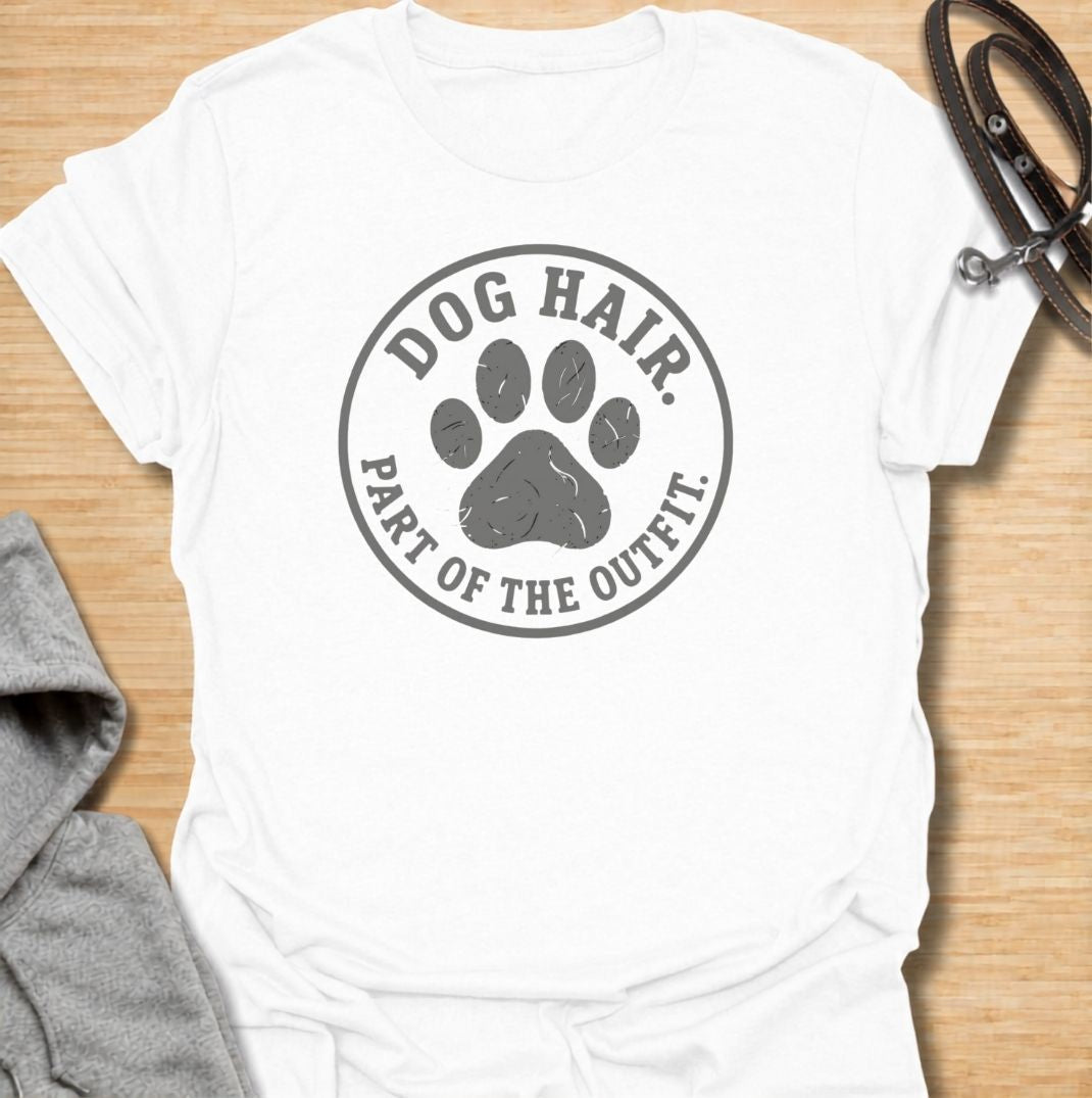 A funny dog T-shirt for anyone who has accepted that pet hair is simply part of everyday life. Featuring the phrase “Dog Hair. Part of the Outfit.” with a paw print graphic, this design is a relatable choice for dog owners who are permanently covered in a little extra fur. Perfect for dog moms, dog dads, rescue dog owners, and anyone who wears their dog’s hair with pride. A simple everyday tee for fans of dog humor, pet lover gifts, and general dog designs.