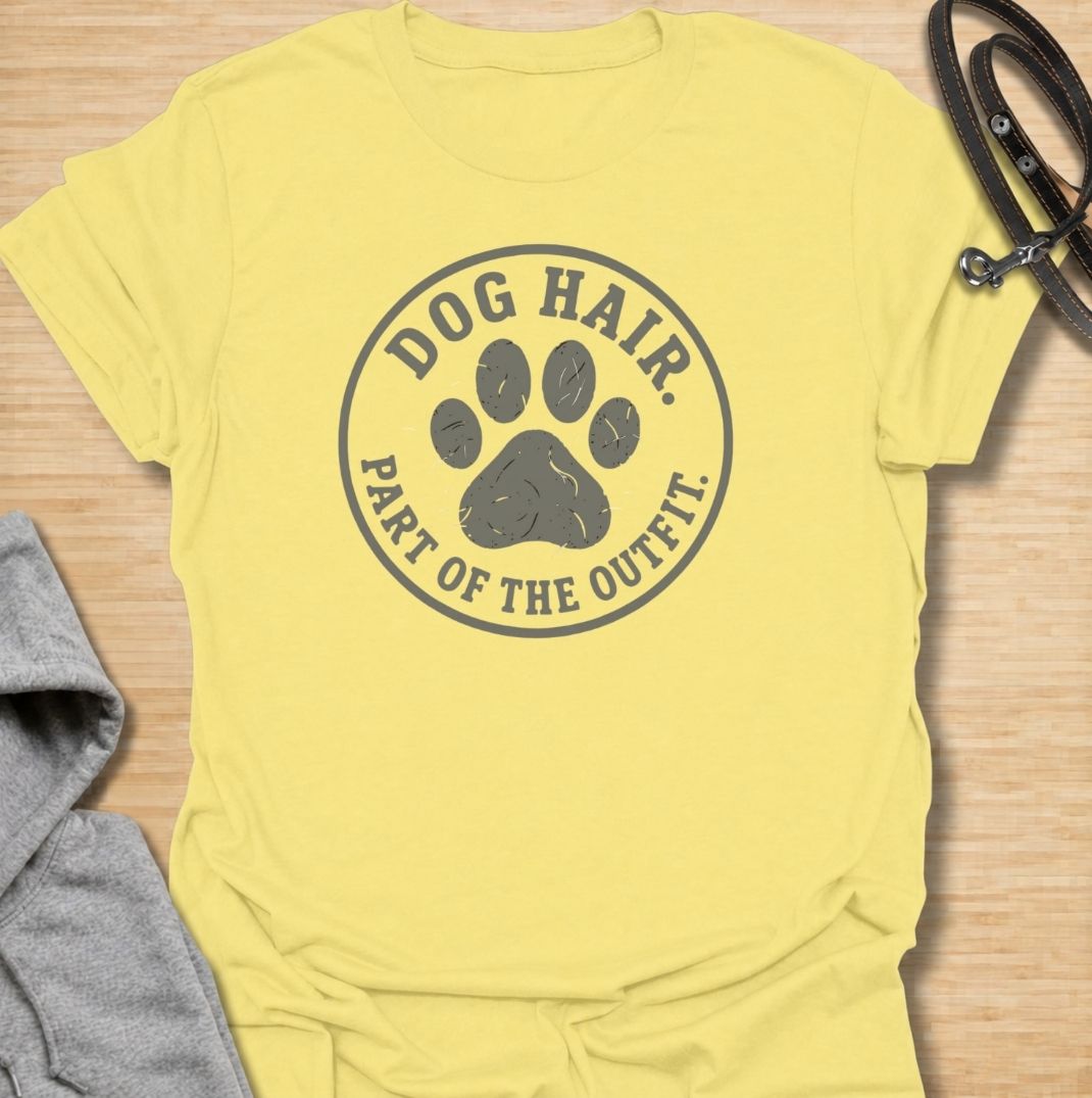 A funny dog T-shirt for anyone who has accepted that pet hair is simply part of everyday life. Featuring the phrase “Dog Hair. Part of the Outfit.” with a paw print graphic, this design is a relatable choice for dog owners who are permanently covered in a little extra fur. Perfect for dog moms, dog dads, rescue dog owners, and anyone who wears their dog’s hair with pride. A simple everyday tee for fans of dog humor, pet lover gifts, and general dog designs.
