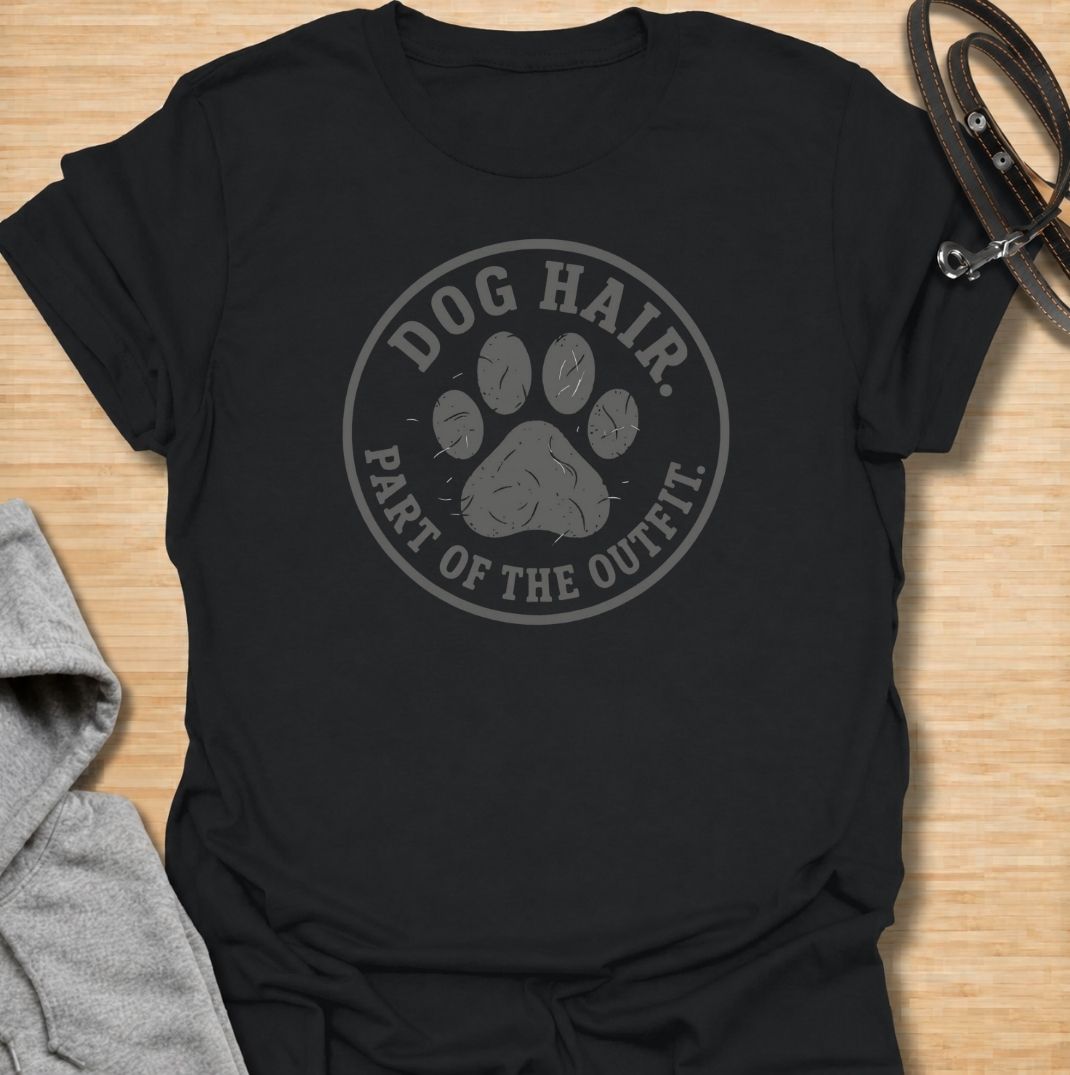 A funny dog T-shirt for anyone who has accepted that pet hair is simply part of everyday life. Featuring the phrase “Dog Hair. Part of the Outfit.” with a paw print graphic, this design is a relatable choice for dog owners who are permanently covered in a little extra fur. Perfect for dog moms, dog dads, rescue dog owners, and anyone who wears their dog’s hair with pride. A simple everyday tee for fans of dog humor, pet lover gifts, and general dog designs.