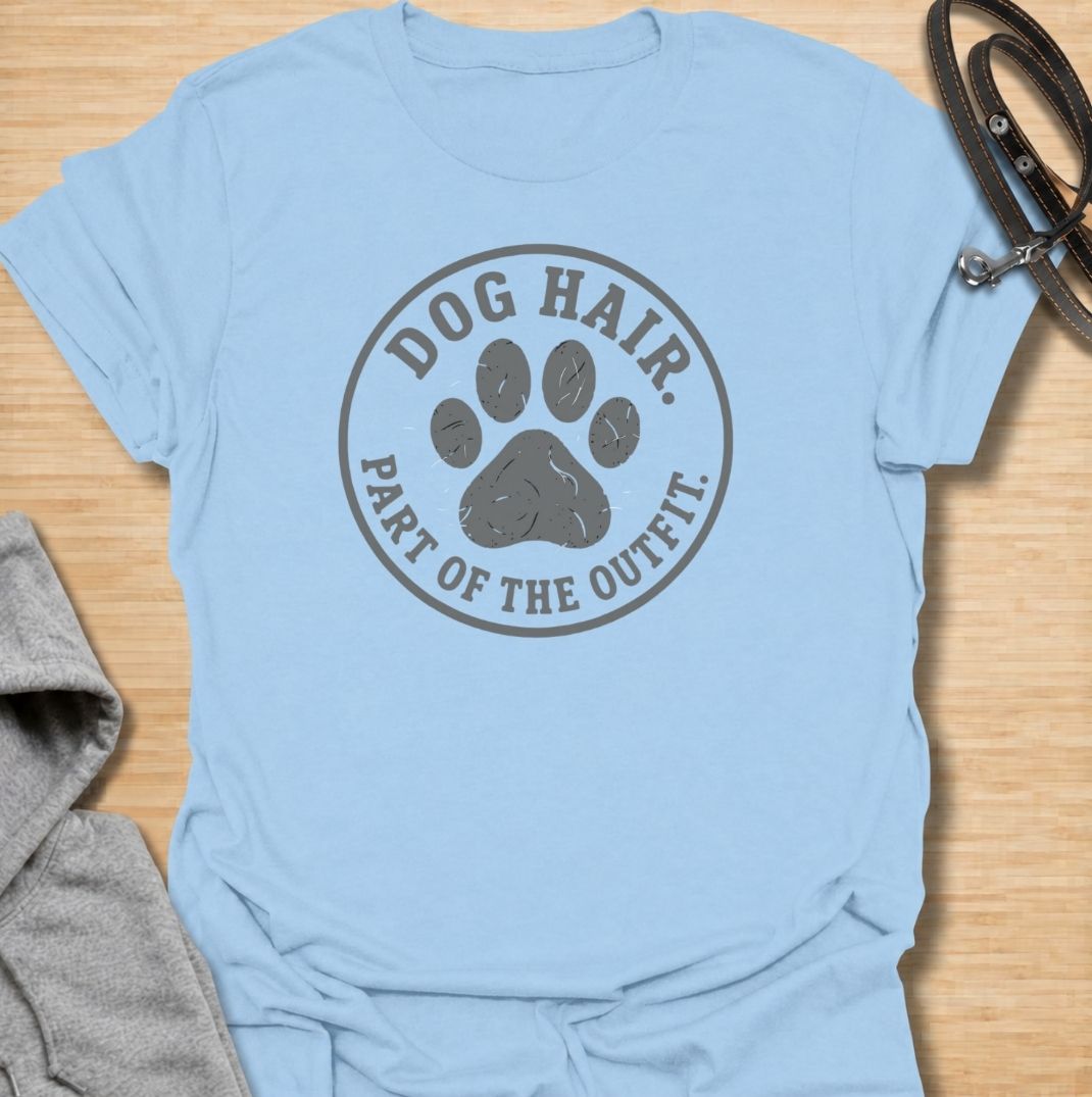 A funny dog T-shirt for anyone who has accepted that pet hair is simply part of everyday life. Featuring the phrase “Dog Hair. Part of the Outfit.” with a paw print graphic, this design is a relatable choice for dog owners who are permanently covered in a little extra fur. Perfect for dog moms, dog dads, rescue dog owners, and anyone who wears their dog’s hair with pride. A simple everyday tee for fans of dog humor, pet lover gifts, and general dog designs.