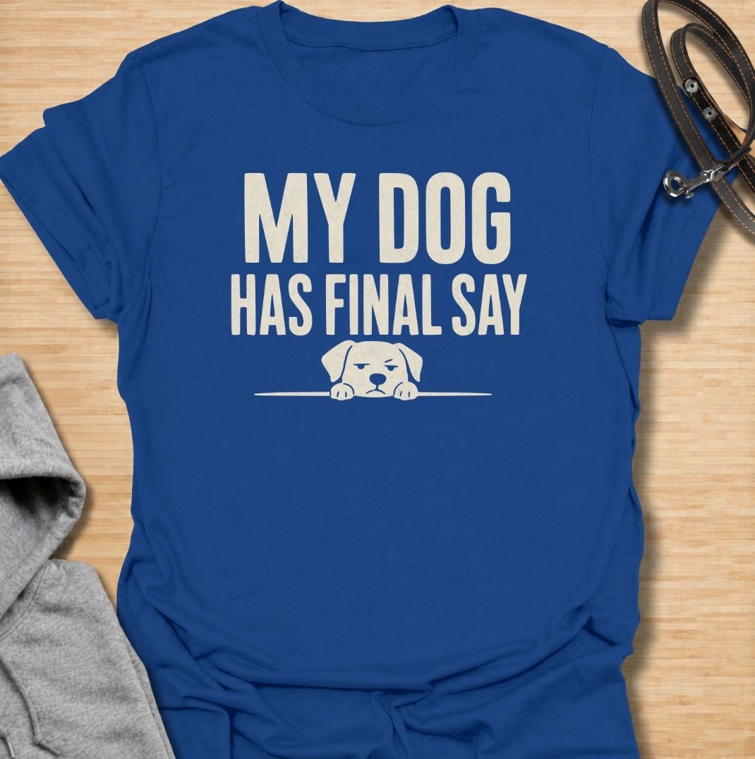 A funny dog T-shirt for anyone who knows who really makes the decisions at home. Featuring the phrase “My Dog Has Final Say” with a simple peeking dog graphic, this design captures the everyday reality of living with a very opinionated four-legged family member. Perfect for dog moms, dog dads, rescue dog owners, and anyone whose plans regularly require canine approval. A clean, playful everyday tee for fans of dog humor, funny pet sayings, and general dog lover gifts.
