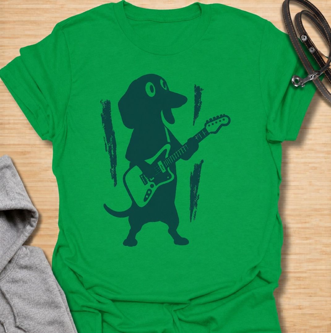 A fun dachshund T-shirt for dog lovers who know their little sausage dog has serious star power. Featuring a bold dachshund playing electric guitar, this design gives the breed a playful rock-and-roll twist without relying on text. Perfect for dachshund moms, dachshund dads, music lovers, and anyone who likes quirky breed-specific dog shirts. A strong everyday graphic tee for fans of doxies, wiener dogs, and dachshunds with big personality.