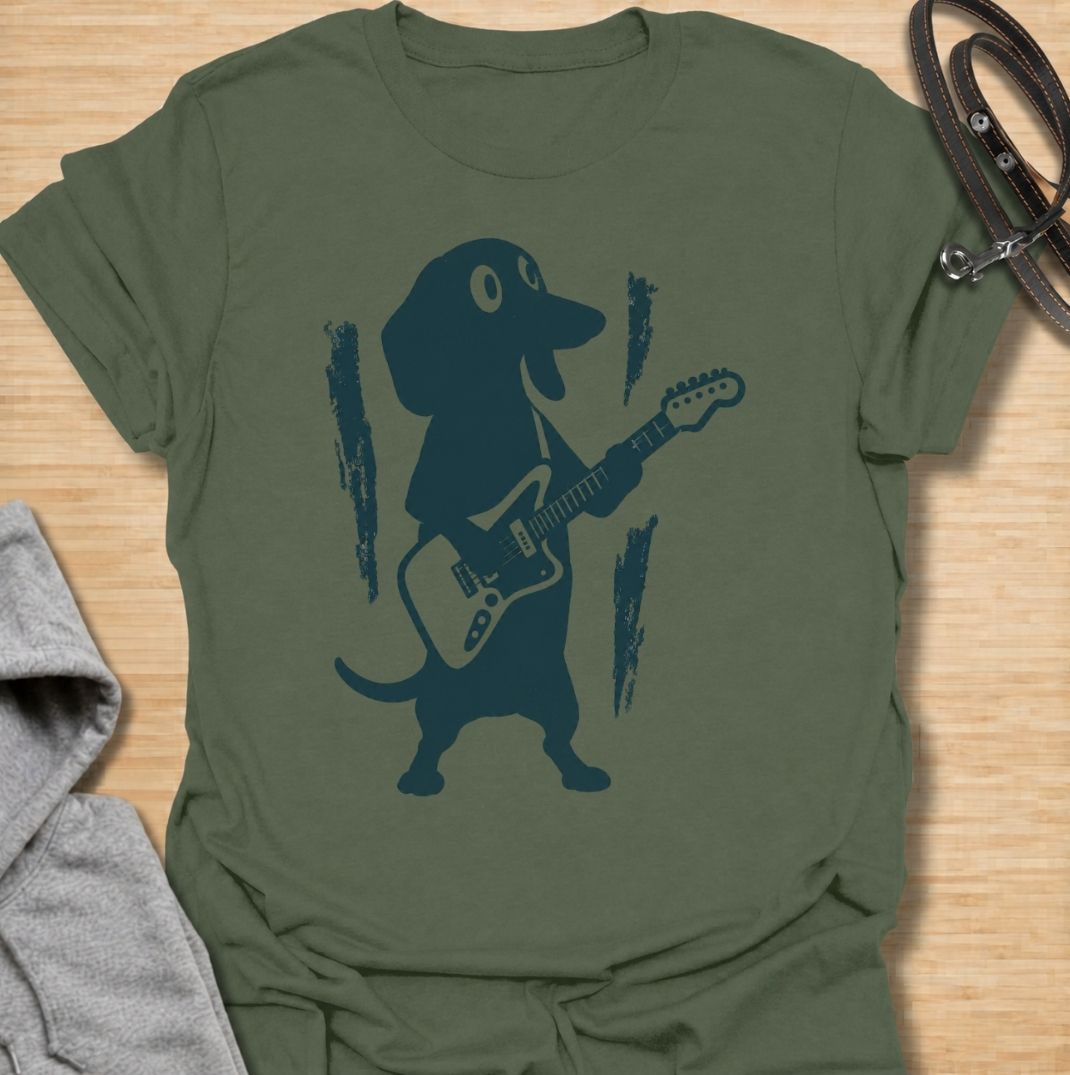 A fun dachshund T-shirt for dog lovers who know their little sausage dog has serious star power. Featuring a bold dachshund playing electric guitar, this design gives the breed a playful rock-and-roll twist without relying on text. Perfect for dachshund moms, dachshund dads, music lovers, and anyone who likes quirky breed-specific dog shirts. A strong everyday graphic tee for fans of doxies, wiener dogs, and dachshunds with big personality.