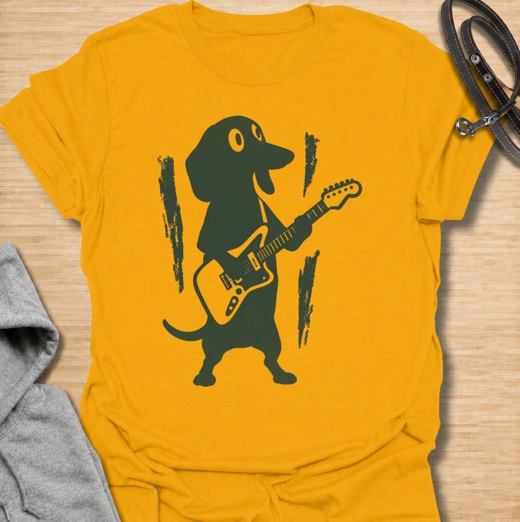 A fun dachshund T-shirt for dog lovers who know their little sausage dog has serious star power. Featuring a bold dachshund playing electric guitar, this design gives the breed a playful rock-and-roll twist without relying on text. Perfect for dachshund moms, dachshund dads, music lovers, and anyone who likes quirky breed-specific dog shirts. A strong everyday graphic tee for fans of doxies, wiener dogs, and dachshunds with big personality.