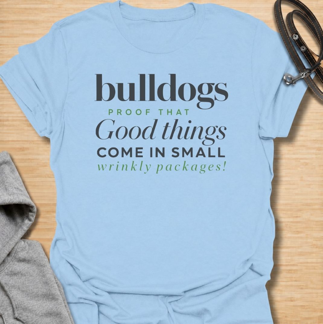 A funny bulldog T-shirt for anyone who loves those compact dogs with oversized personalities and unmistakable wrinkles. Featuring the phrase “Bulldogs — Proof That Good Things Come in Small Wrinkly Packages,” this clean text-based design celebrates the breed’s charm with warm, affectionate humor. Perfect for bulldog moms, bulldog dads, French Bulldog lovers, English Bulldog owners, and anyone who adores wrinkly little dogs. A playful everyday tee for fans of bulldog humor, dog lover gifts, and breed-specifi
