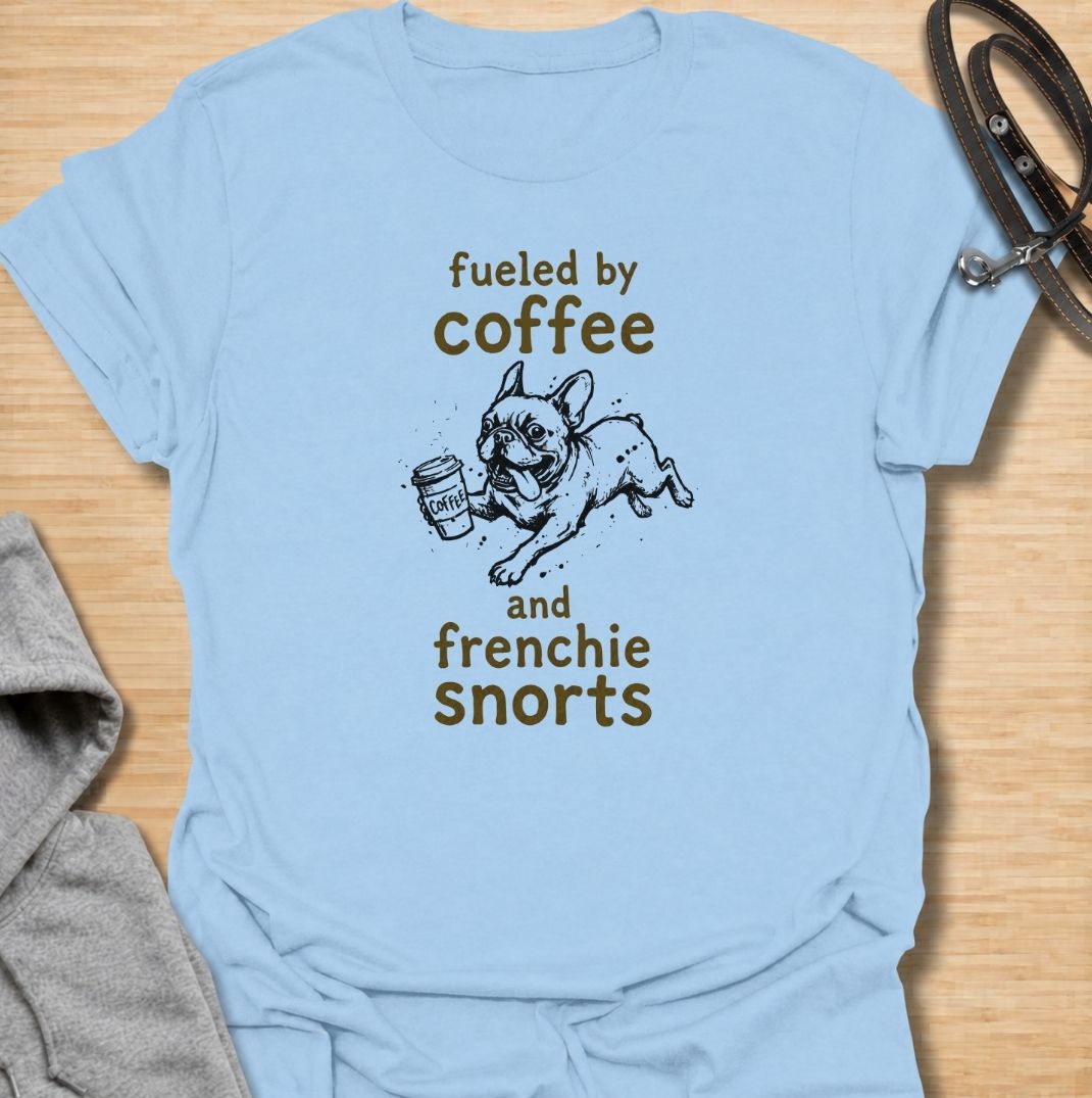 A funny French Bulldog T-shirt for anyone powered by caffeine and Frenchie chaos. Featuring the phrase “Fueled by Coffee and Frenchie Snorts” with a playful French Bulldog carrying a coffee cup, this design combines two everyday favorites in one lighthearted graphic. Perfect for Frenchie moms, Frenchie dads, coffee lovers, and anyone familiar with those unmistakable bulldog snorts. A fun everyday tee for fans of French Bulldog humor, coffee jokes, and breed-specific dog gifts.