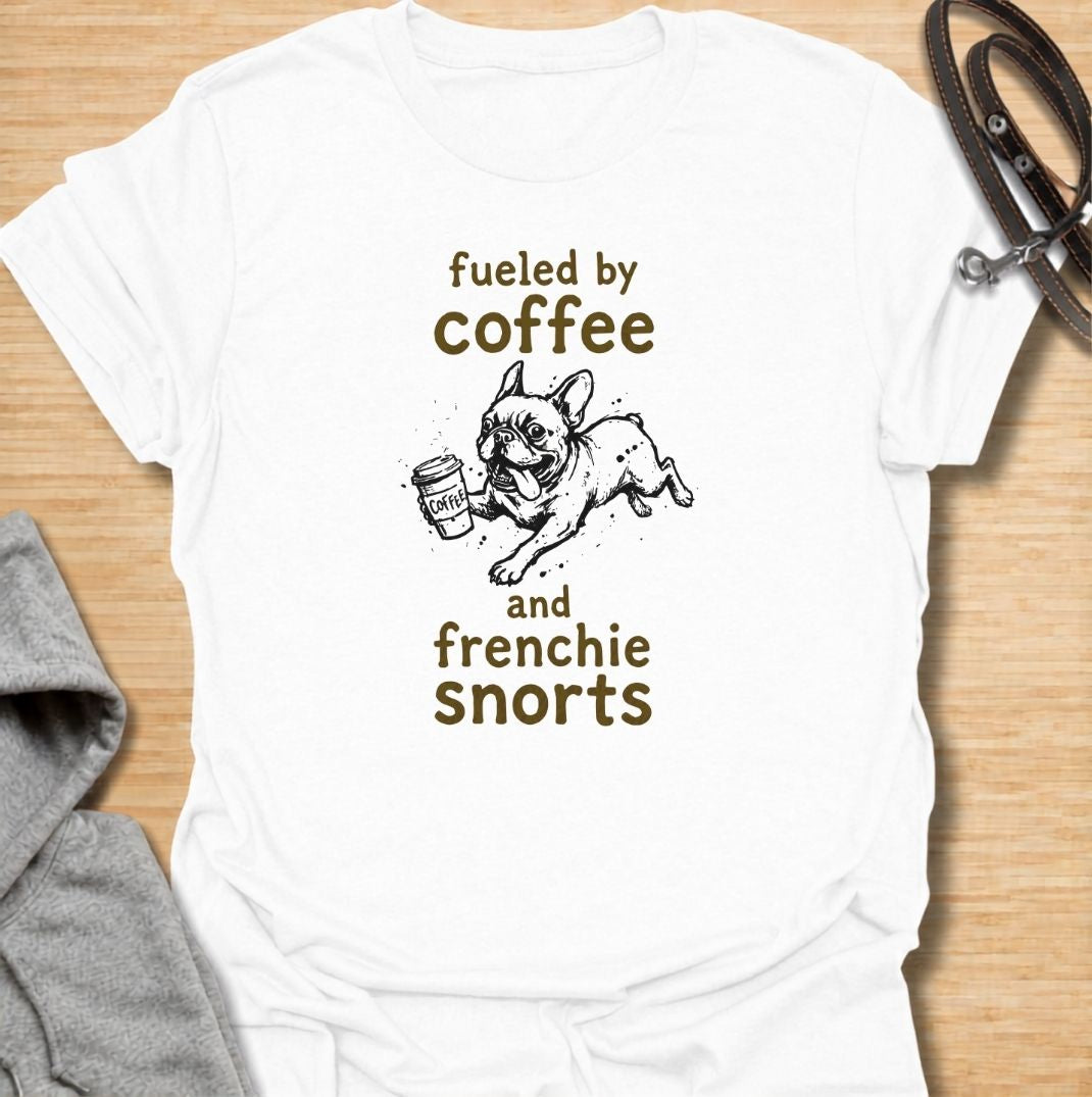 A funny French Bulldog T-shirt for anyone powered by caffeine and Frenchie chaos. Featuring the phrase “Fueled by Coffee and Frenchie Snorts” with a playful French Bulldog carrying a coffee cup, this design combines two everyday favorites in one lighthearted graphic. Perfect for Frenchie moms, Frenchie dads, coffee lovers, and anyone familiar with those unmistakable bulldog snorts. A fun everyday tee for fans of French Bulldog humor, coffee jokes, and breed-specific dog gifts.