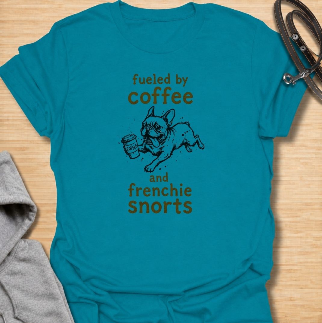 A funny French Bulldog T-shirt for anyone powered by caffeine and Frenchie chaos. Featuring the phrase “Fueled by Coffee and Frenchie Snorts” with a playful French Bulldog carrying a coffee cup, this design combines two everyday favorites in one lighthearted graphic. Perfect for Frenchie moms, Frenchie dads, coffee lovers, and anyone familiar with those unmistakable bulldog snorts. A fun everyday tee for fans of French Bulldog humor, coffee jokes, and breed-specific dog gifts.