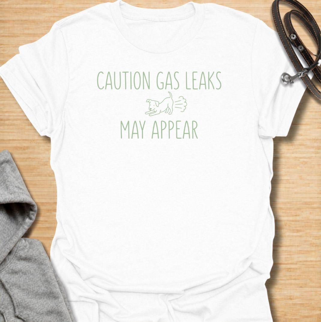 A funny dog T-shirt for anyone familiar with a dog’s less glamorous little habits. Featuring the phrase “Caution: Gas Leaks May Appear” with a simple dog graphic, this design turns classic dog flatulence into lighthearted  humor. Perfect for dog moms, dog dads, dog lovers, and anyone who has learned to expect the occasional suspicious smell. A playful everyday tee for fans of dog humor, funny dog sayings, and dog lover gifts.