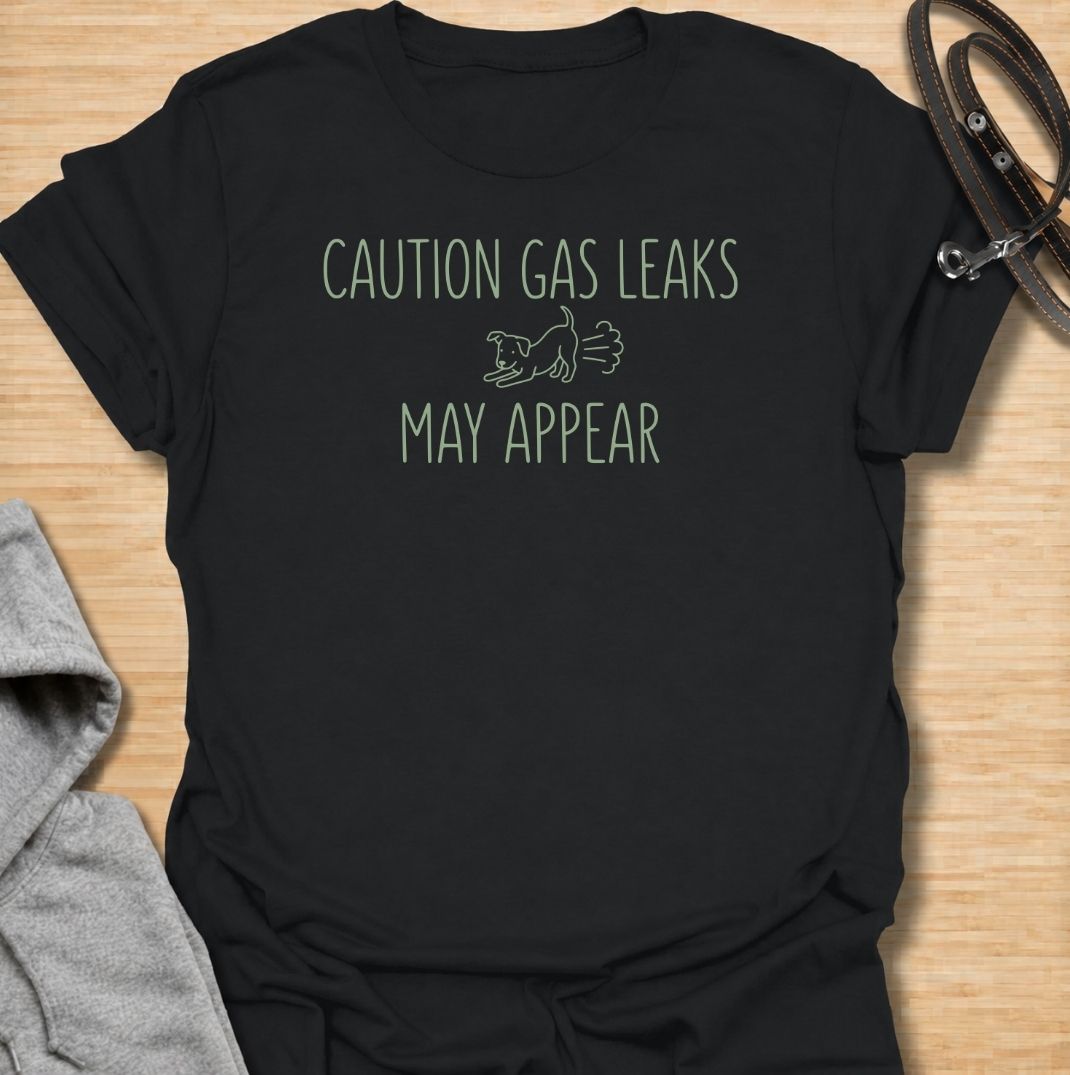 A funny dog T-shirt for anyone familiar with a dog’s less glamorous little habits. Featuring the phrase “Caution: Gas Leaks May Appear” with a simple dog graphic, this design turns classic dog flatulence into lighthearted  humor. Perfect for dog moms, dog dads, dog lovers, and anyone who has learned to expect the occasional suspicious smell. A playful everyday tee for fans of dog humor, funny dog sayings, and dog lover gifts.