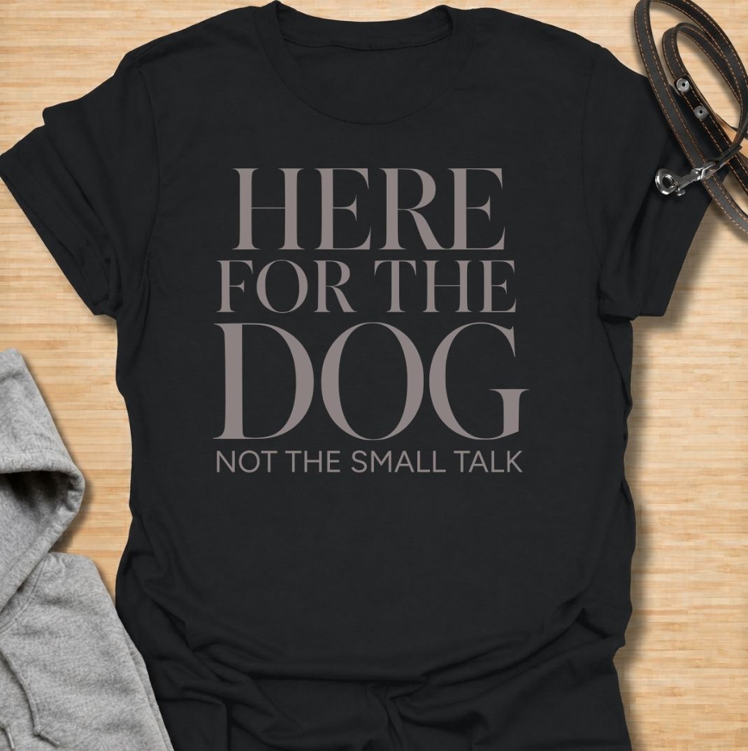 A funny dog T-shirt for anyone who would rather meet the dog than make small talk. Featuring the phrase “Here for the Dog, Not the Small Talk,” this clean text-based design speaks directly to introverted dog lovers and anyone who prefers four-legged company. Perfect for dog moms, dog dads, rescue dog owners, and anyone who heads straight for the dog at every gathering. A simple everyday tee for fans of dry dog humor, pet parent sayings, and general dog lover gifts.