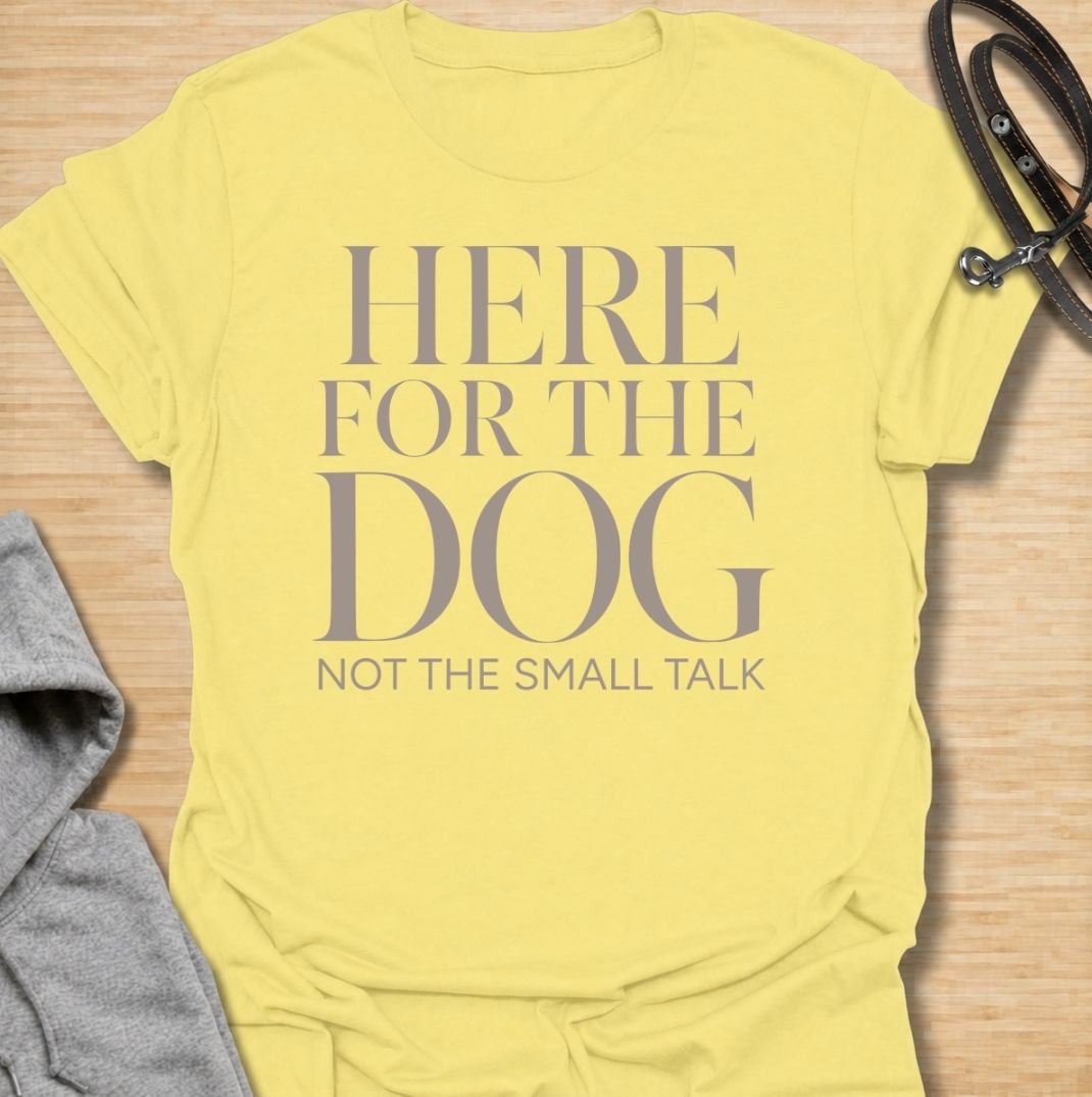 A funny dog T-shirt for anyone who would rather meet the dog than make small talk. Featuring the phrase “Here for the Dog, Not the Small Talk,” this clean text-based design speaks directly to introverted dog lovers and anyone who prefers four-legged company. Perfect for dog moms, dog dads, rescue dog owners, and anyone who heads straight for the dog at every gathering. A simple everyday tee for fans of dry dog humor, pet parent sayings, and general dog lover gifts.