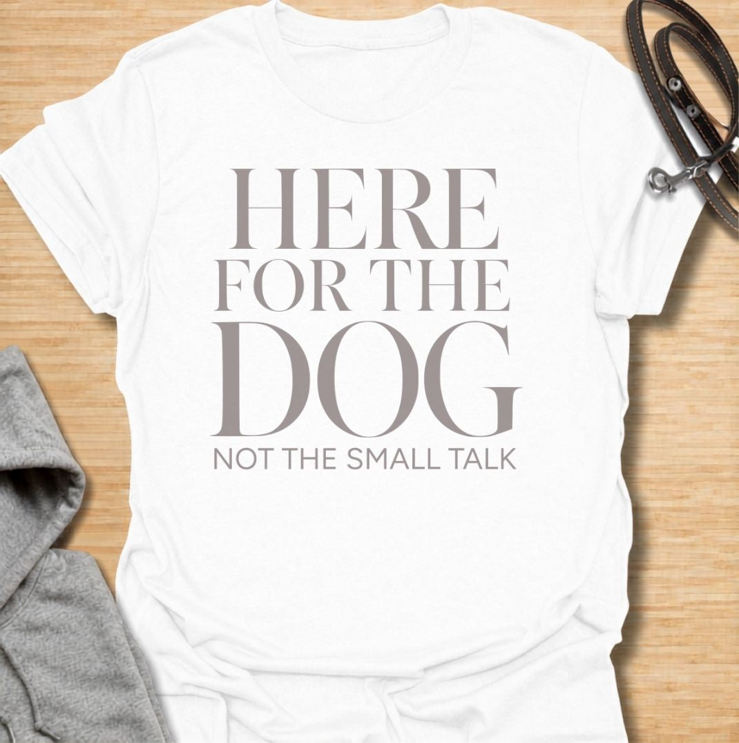 A funny dog T-shirt for anyone who would rather meet the dog than make small talk. Featuring the phrase “Here for the Dog, Not the Small Talk,” this clean text-based design speaks directly to introverted dog lovers and anyone who prefers four-legged company. Perfect for dog moms, dog dads, rescue dog owners, and anyone who heads straight for the dog at every gathering. A simple everyday tee for fans of dry dog humor, pet parent sayings, and general dog lover gifts.