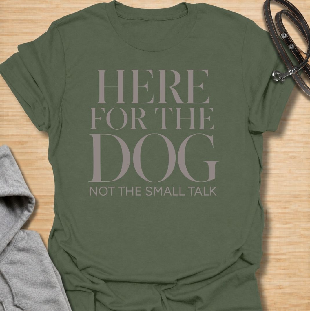 A funny dog T-shirt for anyone who would rather meet the dog than make small talk. Featuring the phrase “Here for the Dog, Not the Small Talk,” this clean text-based design speaks directly to introverted dog lovers and anyone who prefers four-legged company. Perfect for dog moms, dog dads, rescue dog owners, and anyone who heads straight for the dog at every gathering. A simple everyday tee for fans of dry dog humor, pet parent sayings, and general dog lover gifts.