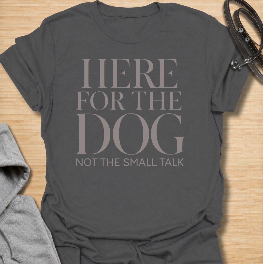 A funny dog T-shirt for anyone who would rather meet the dog than make small talk. Featuring the phrase “Here for the Dog, Not the Small Talk,” this clean text-based design speaks directly to introverted dog lovers and anyone who prefers four-legged company. Perfect for dog moms, dog dads, rescue dog owners, and anyone who heads straight for the dog at every gathering. A simple everyday tee for fans of dry dog humor, pet parent sayings, and general dog lover gifts.