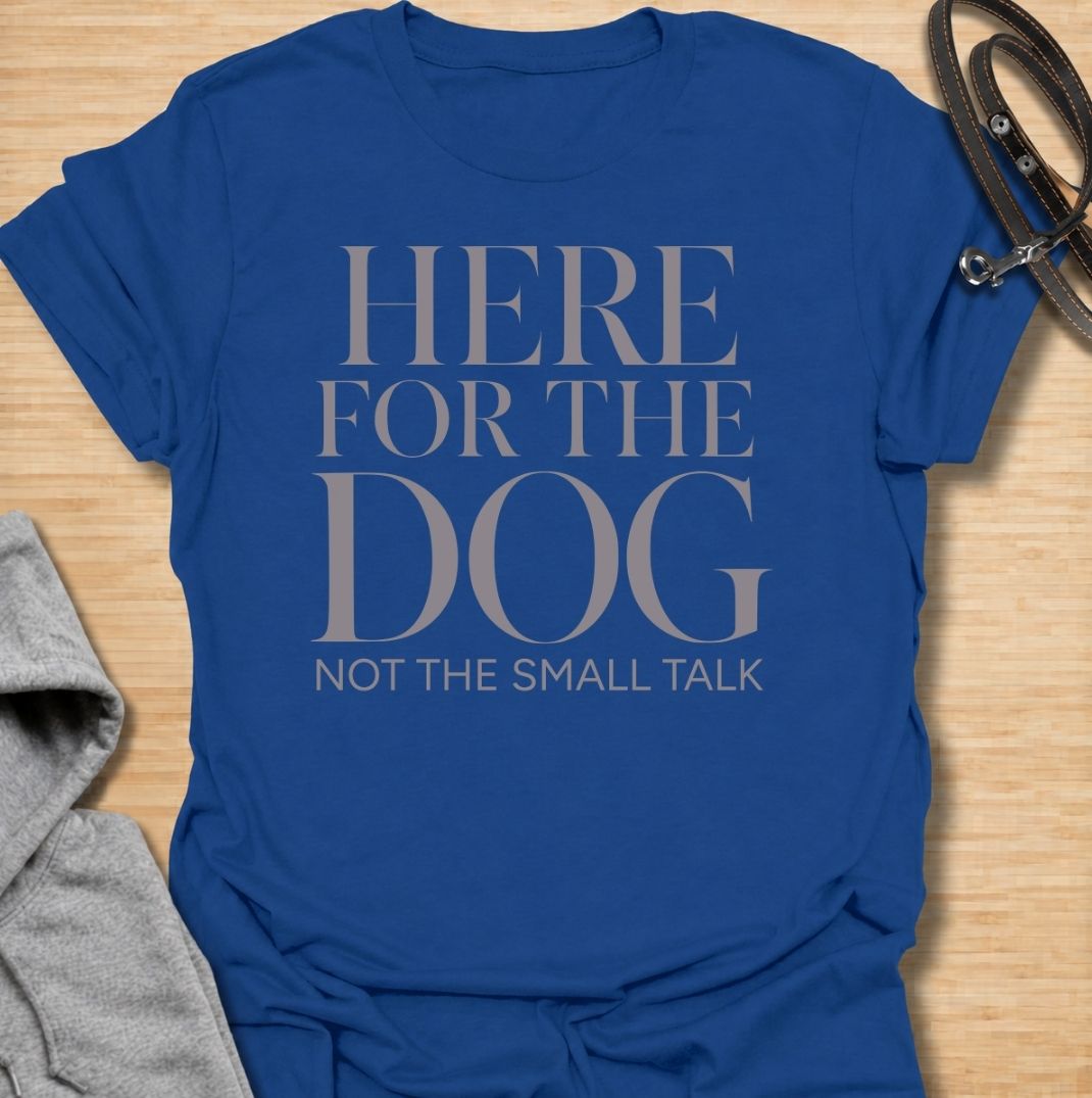 A funny dog T-shirt for anyone who would rather meet the dog than make small talk. Featuring the phrase “Here for the Dog, Not the Small Talk,” this clean text-based design speaks directly to introverted dog lovers and anyone who prefers four-legged company. Perfect for dog moms, dog dads, rescue dog owners, and anyone who heads straight for the dog at every gathering. A simple everyday tee for fans of dry dog humor, pet parent sayings, and general dog lover gifts.