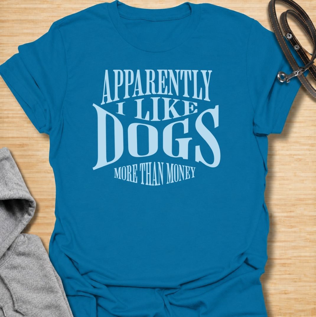 A funny dog T-shirt for anyone who knows exactly where their priorities lie. Featuring the phrase “Apparently I Like Dogs More Than Money,” this bold text-based design is perfect for devoted dog people who happily spend on treats, toys, beds, and anything else their pet might need. Ideal for dog moms, dog dads, rescue dog owners, and anyone whose bank balance regularly loses to their four-legged companion. A playful everyday tee for fans of dog humor, funny pet sayings, and general dog lover gifts.