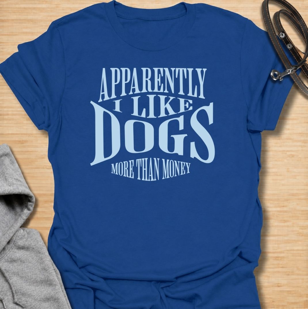 A funny dog T-shirt for anyone who knows exactly where their priorities lie. Featuring the phrase “Apparently I Like Dogs More Than Money,” this bold text-based design is perfect for devoted dog people who happily spend on treats, toys, beds, and anything else their pet might need. Ideal for dog moms, dog dads, rescue dog owners, and anyone whose bank balance regularly loses to their four-legged companion. A playful everyday tee for fans of dog humor, funny pet sayings, and general dog lover gifts.