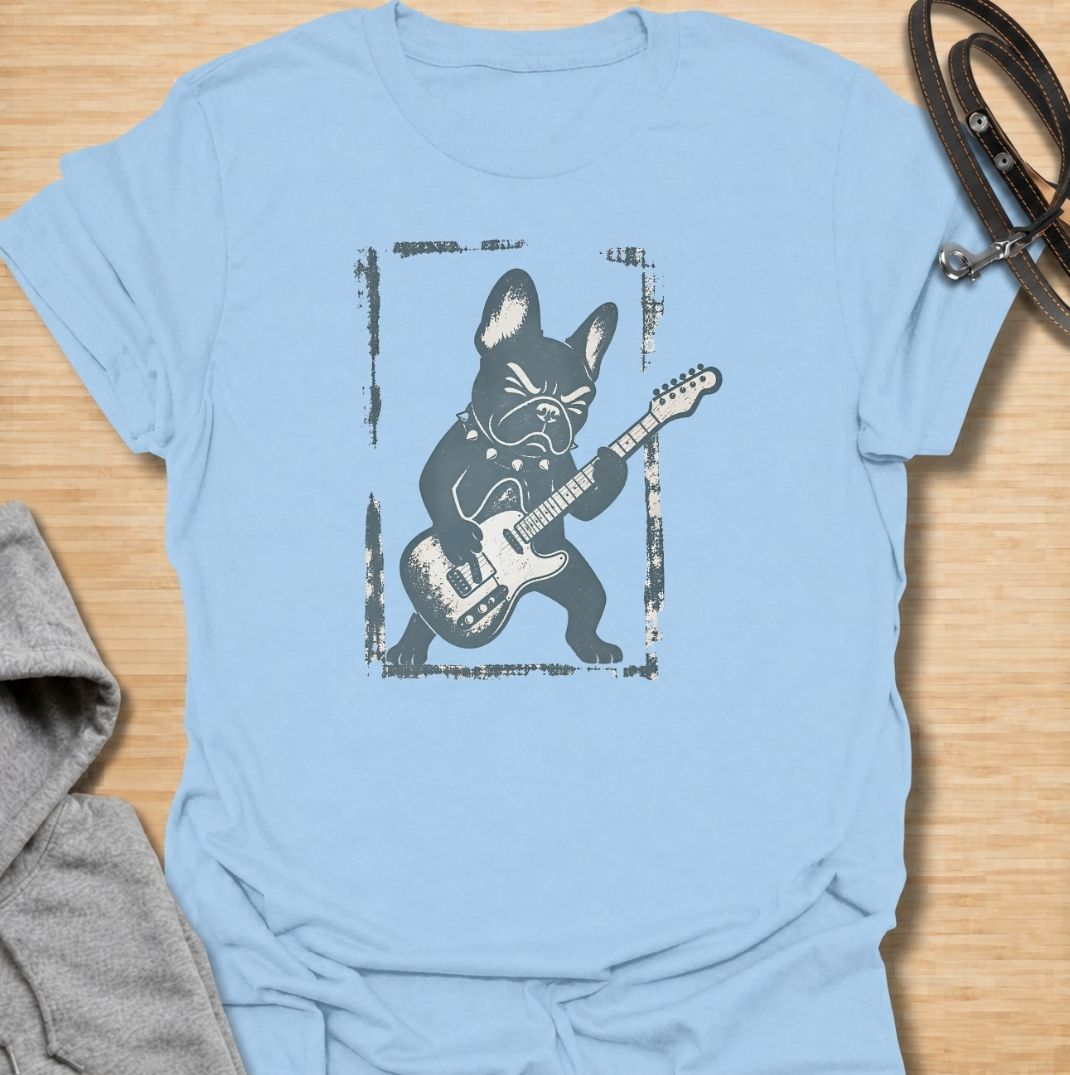 A fun French Bulldog T-shirt for anyone who knows their Frenchie has serious attitude and main-stage energy. Featuring a bold French Bulldog playing electric guitar, this graphic gives the breed a playful rock-and-roll twist without needing a slogan. Perfect for Frenchie moms, Frenchie dads, music lovers, and anyone who likes quirky breed-specific dog shirts. A strong everyday tee for fans of French Bulldog humor, alternative dog art, and unique dog lover gifts.