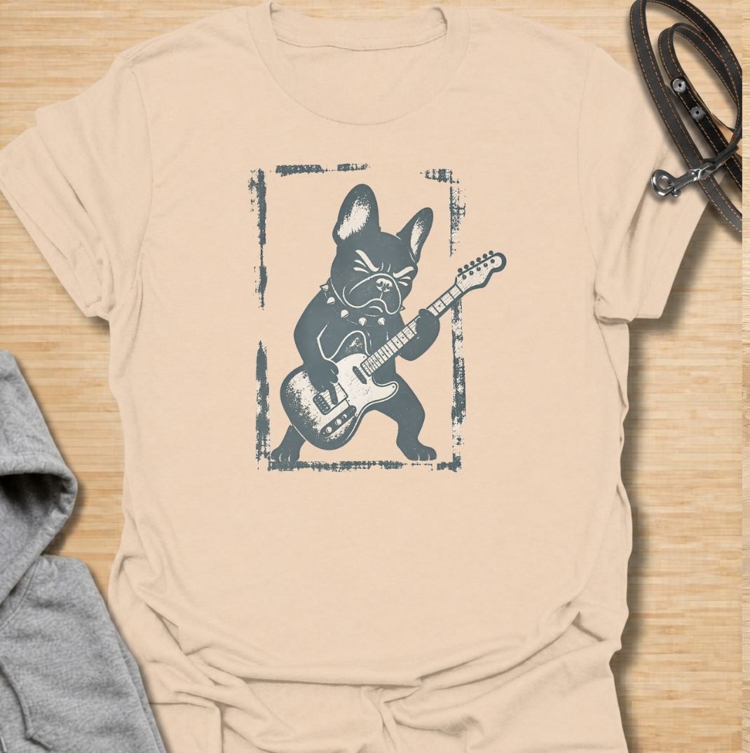 A fun French Bulldog T-shirt for anyone who knows their Frenchie has serious attitude and main-stage energy. Featuring a bold French Bulldog playing electric guitar, this graphic gives the breed a playful rock-and-roll twist without needing a slogan. Perfect for Frenchie moms, Frenchie dads, music lovers, and anyone who likes quirky breed-specific dog shirts. A strong everyday tee for fans of French Bulldog humor, alternative dog art, and unique dog lover gifts.