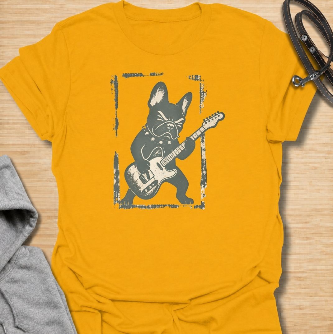 A fun French Bulldog T-shirt for anyone who knows their Frenchie has serious attitude and main-stage energy. Featuring a bold French Bulldog playing electric guitar, this graphic gives the breed a playful rock-and-roll twist without needing a slogan. Perfect for Frenchie moms, Frenchie dads, music lovers, and anyone who likes quirky breed-specific dog shirts. A strong everyday tee for fans of French Bulldog humor, alternative dog art, and unique dog lover gifts.