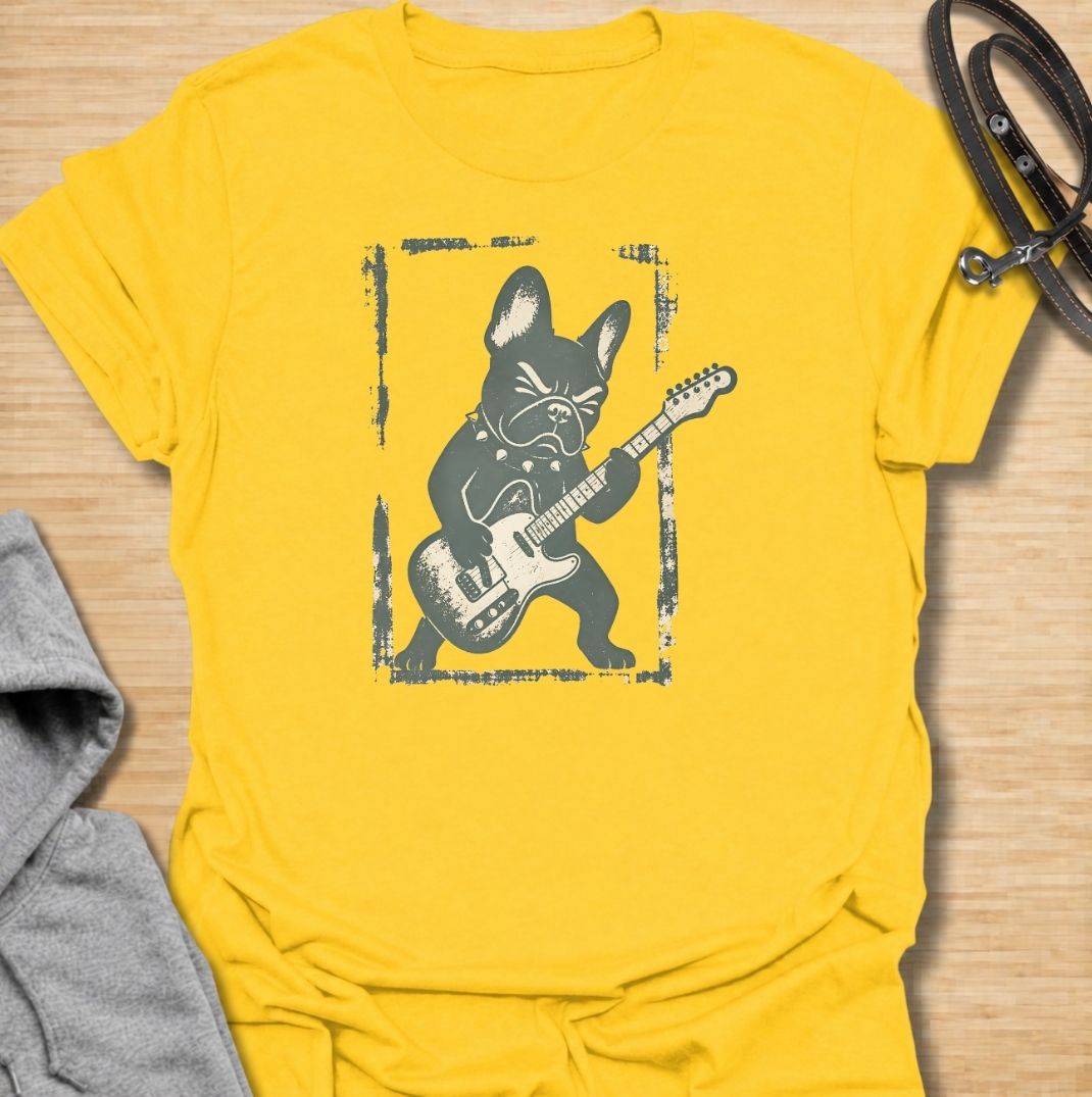 A fun French Bulldog T-shirt for anyone who knows their Frenchie has serious attitude and main-stage energy. Featuring a bold French Bulldog playing electric guitar, this graphic gives the breed a playful rock-and-roll twist without needing a slogan. Perfect for Frenchie moms, Frenchie dads, music lovers, and anyone who likes quirky breed-specific dog shirts. A strong everyday tee for fans of French Bulldog humor, alternative dog art, and unique dog lover gifts.