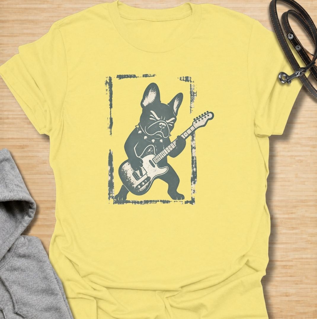 A fun French Bulldog T-shirt for anyone who knows their Frenchie has serious attitude and main-stage energy. Featuring a bold French Bulldog playing electric guitar, this graphic gives the breed a playful rock-and-roll twist without needing a slogan. Perfect for Frenchie moms, Frenchie dads, music lovers, and anyone who likes quirky breed-specific dog shirts. A strong everyday tee for fans of French Bulldog humor, alternative dog art, and unique dog lover gifts.