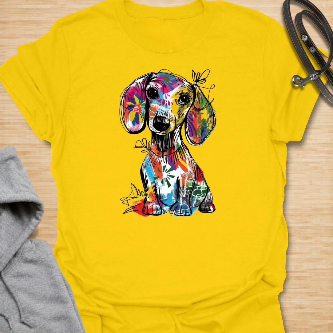 This abstract dachshund t-shirt is full of color, personality, and playful dog lover energy. The bold paint-splash style gives the classic dachshund silhouette a fun, artsy twist that stands out from ordinary dog shirts. It is perfect for dachshund moms, doxie dads, and anyone who loves long dogs with big character. A bright, expressive choice for casual days, dog walks, coffee runs, or gifting to a dachshund lover.