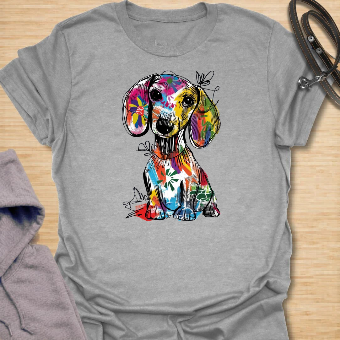 This abstract dachshund t-shirt is full of color, personality, and playful dog lover energy. The bold paint-splash style gives the classic dachshund silhouette a fun, artsy twist that stands out from ordinary dog shirts. It is perfect for dachshund moms, doxie dads, and anyone who loves long dogs with big character. A bright, expressive choice for casual days, dog walks, coffee runs, or gifting to a dachshund lover.