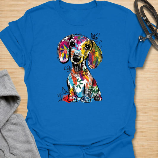 This abstract dachshund t-shirt is full of color, personality, and playful dog lover energy. The bold paint-splash style gives the classic dachshund silhouette a fun, artsy twist that stands out from ordinary dog shirts. It is perfect for dachshund moms, doxie dads, and anyone who loves long dogs with big character. A bright, expressive choice for casual days, dog walks, coffee runs, or gifting to a dachshund lover.