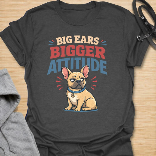 This Big Ears Bigger Attitude t-shirt is made for French Bulldog lovers who know those famous bat ears come with plenty of sass. Featuring bold retro lettering, a grumpy cartoon Frenchie, and a funny breed-specific message, this design has a playful dog-parent feel that Frenchie owners will instantly understand. Perfect for Frenchie moms, Frenchie dads, French Bulldog owners, rescue dog lovers, and anyone whose small dog has a seriously big personality.