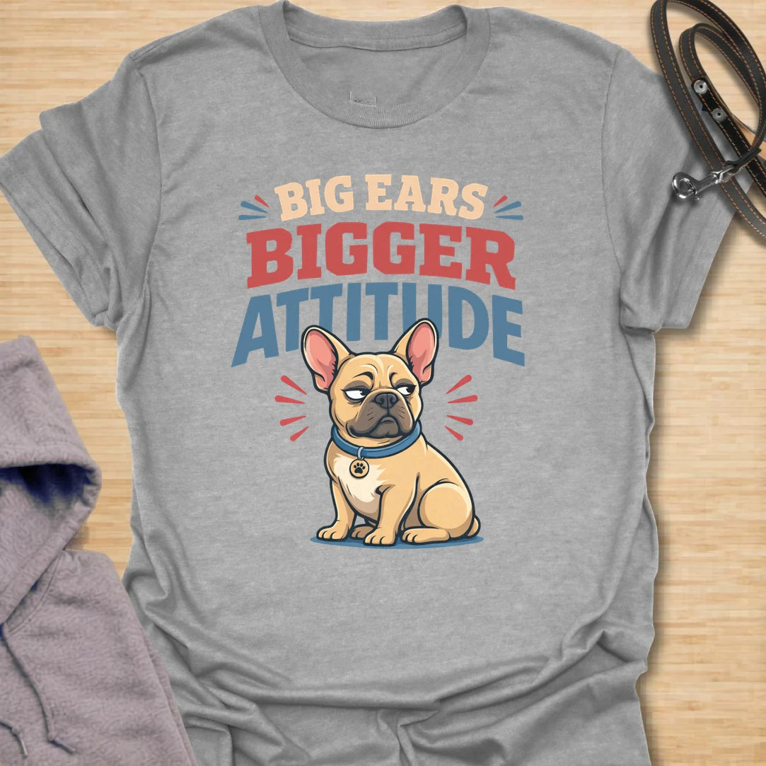 This Big Ears Bigger Attitude t-shirt is made for French Bulldog lovers who know those famous bat ears come with plenty of sass. Featuring bold retro lettering, a grumpy cartoon Frenchie, and a funny breed-specific message, this design has a playful dog-parent feel that Frenchie owners will instantly understand. Perfect for Frenchie moms, Frenchie dads, French Bulldog owners, rescue dog lovers, and anyone whose small dog has a seriously big personality.