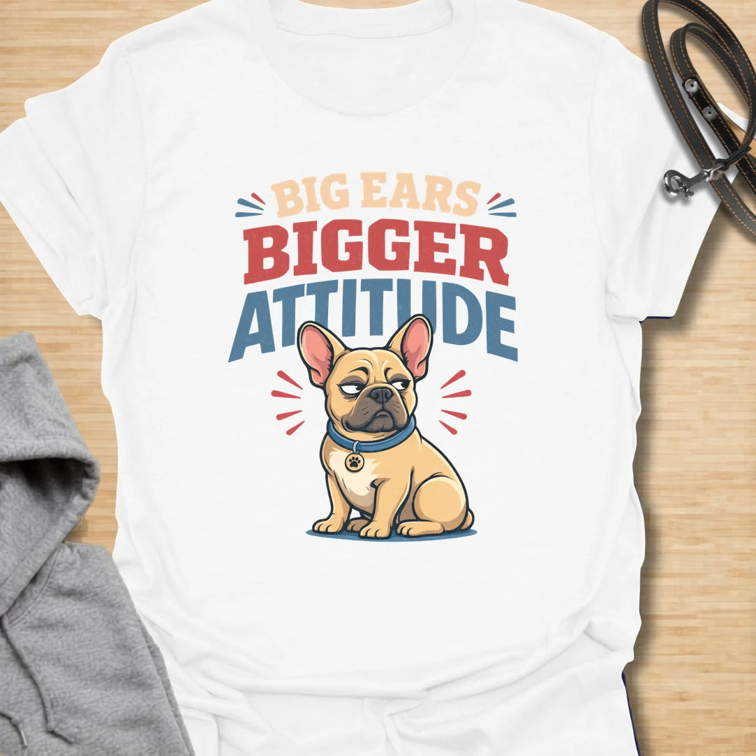 This Big Ears Bigger Attitude t-shirt is made for French Bulldog lovers who know those famous bat ears come with plenty of sass. Featuring bold retro lettering, a grumpy cartoon Frenchie, and a funny breed-specific message, this design has a playful dog-parent feel that Frenchie owners will instantly understand. Perfect for Frenchie moms, Frenchie dads, French Bulldog owners, rescue dog lovers, and anyone whose small dog has a seriously big personality.