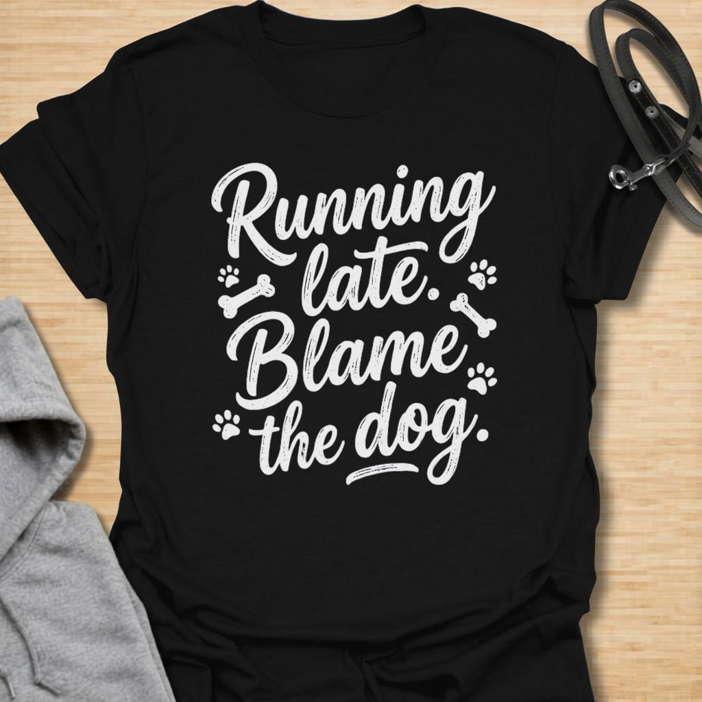 Funny dog lover t-shirt featuring the phrase “Running late. Blame the dog.” A perfect tee for dog moms, dog dads, rescue dog owners, and pet parents who know dogs always come first.