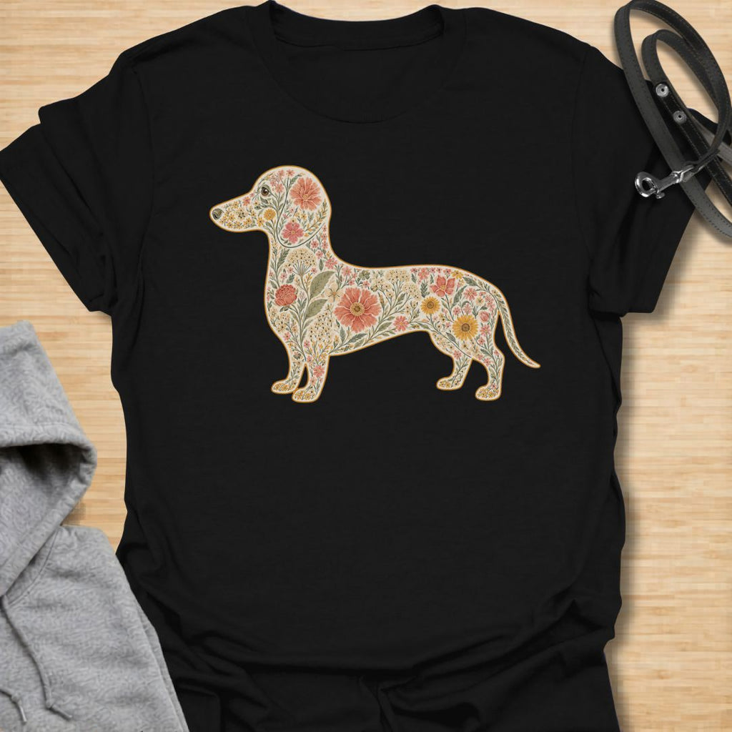 This Floral Dachshund t-shirt is made for doxie lovers who want a beautiful, botanical take on their favorite long dog. Featuring a dachshund silhouette filled with intricate flowers, leaves, vines, and vintage-style floral details, this design blends dog-lover charm with soft garden-inspired artwork. Perfect for dachshund moms, dachshund dads, wiener dog lovers, sausage dog fans, botanical art lovers, and anyone who loves both dogs and flowers.