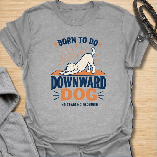 A funny dog yoga T-shirt featuring a cheerful pup demonstrating the original downward dog pose. The bold retro-inspired design is perfect for dog lovers, yoga fans, and anyone who believes stretching should require no training. A playful gift for yoga enthusiasts, dog moms, fitness lovers, and pet owners.