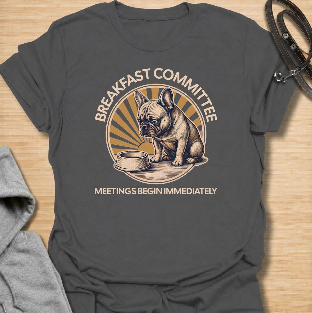 For French bulldogs who take breakfast very seriously and expect meetings to begin the second they wake up. This funny Frenchie T-shirt features the phrase “Breakfast Committee – Meetings Begin Immediately” with a wonderfully impatient bulldog waiting beside an empty bowl. Perfect for French bulldog owners who know mealtimes are less of a routine and more of a daily emergency. A fun vintage-style dog lover tee packed with classic Frenchie attitude.