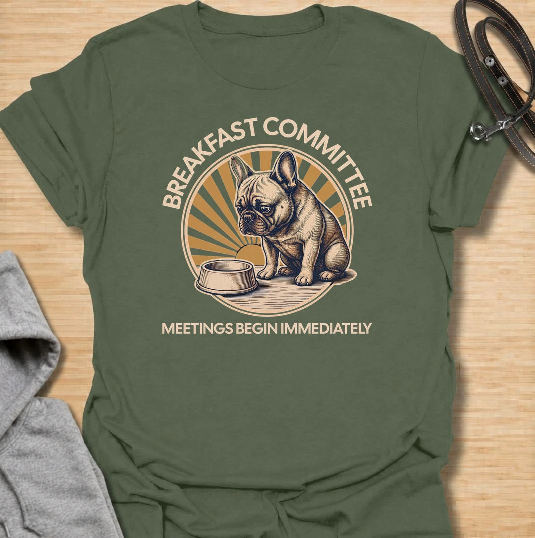 For French bulldogs who take breakfast very seriously and expect meetings to begin the second they wake up. This funny Frenchie T-shirt features the phrase “Breakfast Committee – Meetings Begin Immediately” with a wonderfully impatient bulldog waiting beside an empty bowl. Perfect for French bulldog owners who know mealtimes are less of a routine and more of a daily emergency. A fun vintage-style dog lover tee packed with classic Frenchie attitude.