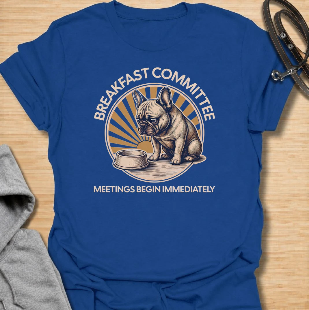 For French bulldogs who take breakfast very seriously and expect meetings to begin the second they wake up. This funny Frenchie T-shirt features the phrase “Breakfast Committee – Meetings Begin Immediately” with a wonderfully impatient bulldog waiting beside an empty bowl. Perfect for French bulldog owners who know mealtimes are less of a routine and more of a daily emergency. A fun vintage-style dog lover tee packed with classic Frenchie attitude.