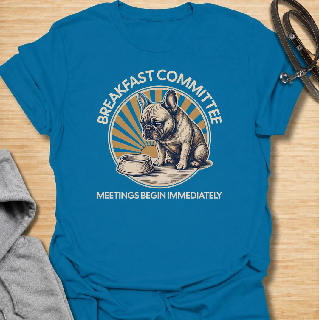 For French bulldogs who take breakfast very seriously and expect meetings to begin the second they wake up. This funny Frenchie T-shirt features the phrase “Breakfast Committee – Meetings Begin Immediately” with a wonderfully impatient bulldog waiting beside an empty bowl. Perfect for French bulldog owners who know mealtimes are less of a routine and more of a daily emergency. A fun vintage-style dog lover tee packed with classic Frenchie attitude.