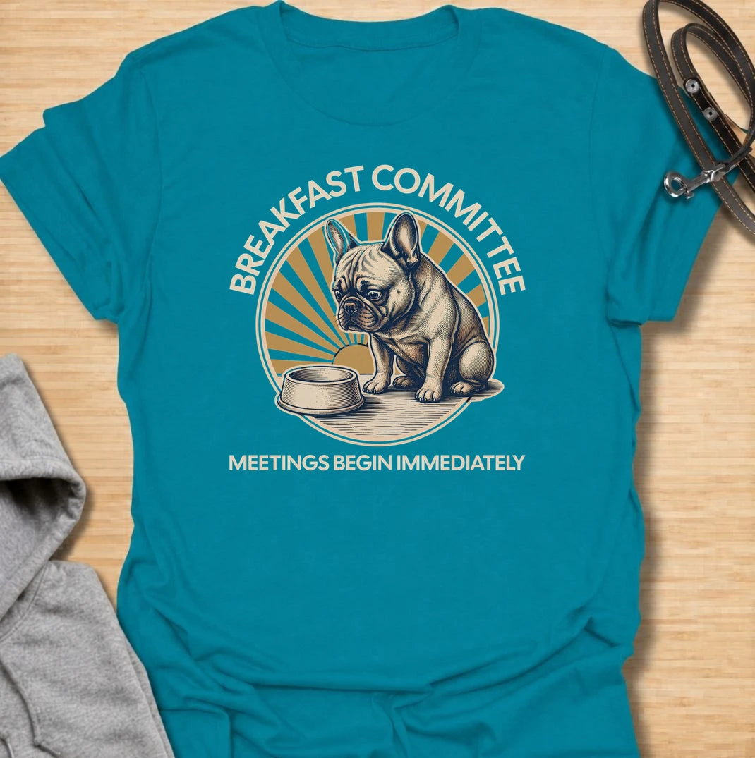 For French bulldogs who take breakfast very seriously and expect meetings to begin the second they wake up. This funny Frenchie T-shirt features the phrase “Breakfast Committee – Meetings Begin Immediately” with a wonderfully impatient bulldog waiting beside an empty bowl. Perfect for French bulldog owners who know mealtimes are less of a routine and more of a daily emergency. A fun vintage-style dog lover tee packed with classic Frenchie attitude.