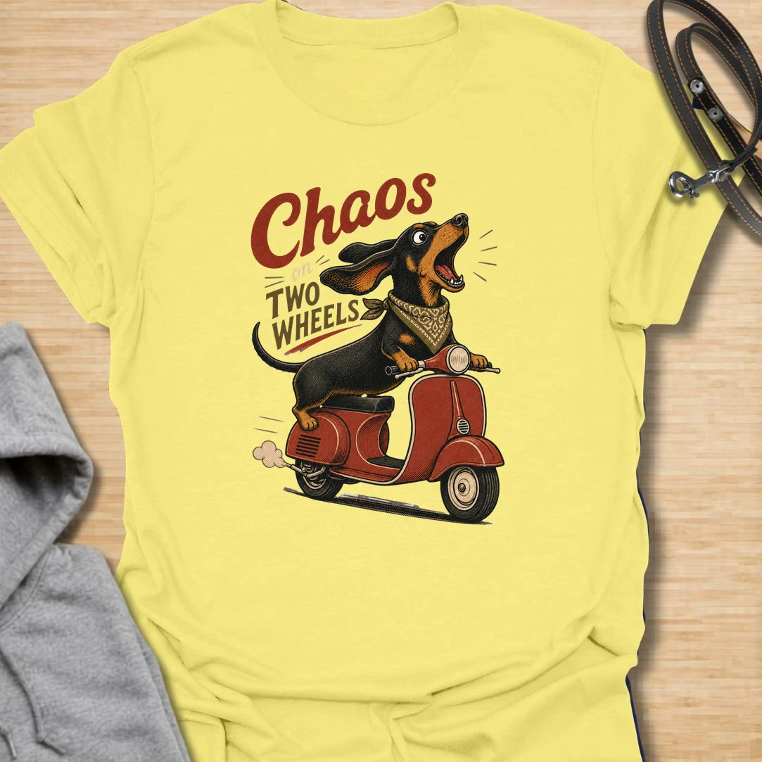 Chaos on two wheels dachshund t-shirt for anyone whose sausage dog seems to manage the household mayhem. This funny vintage-style design features a bold dachshund racing along on a scooter with retro lettering and plenty of doxie attitude. Perfect for dachshund moms, doxie dads, wiener dog lovers, and small dog owners who know chaos is part of the charm.