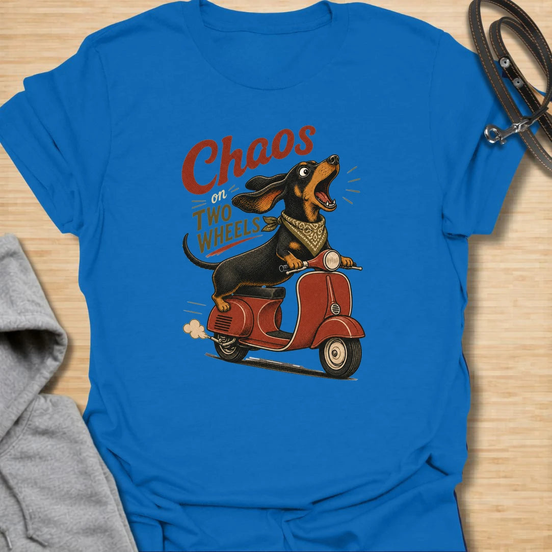Chaos on two wheels dachshund t-shirt for anyone whose sausage dog seems to manage the household mayhem. This funny vintage-style design features a bold dachshund racing along on a scooter with retro lettering and plenty of doxie attitude. Perfect for dachshund moms, doxie dads, wiener dog lovers, and small dog owners who know chaos is part of the charm.