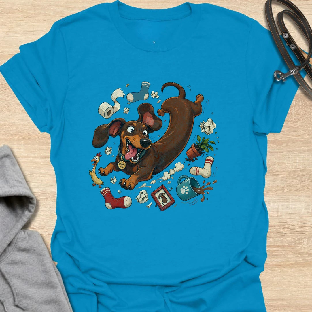 Funny dachshund t-shirt featuring a wild and mischievous doxie surrounded by total household chaos. The “Chaos Reigns” design is perfect for dachshund owners who know these little dogs may be small, but they bring huge personality, energy, and trouble wherever they go. With its playful artwork and humorous theme, this shirt is a great fit for dog moms, dog dads, and anyone obsessed with funny wiener dog apparel. It also makes a great gift for dachshund lovers who appreciate the messy, lovable, and completel